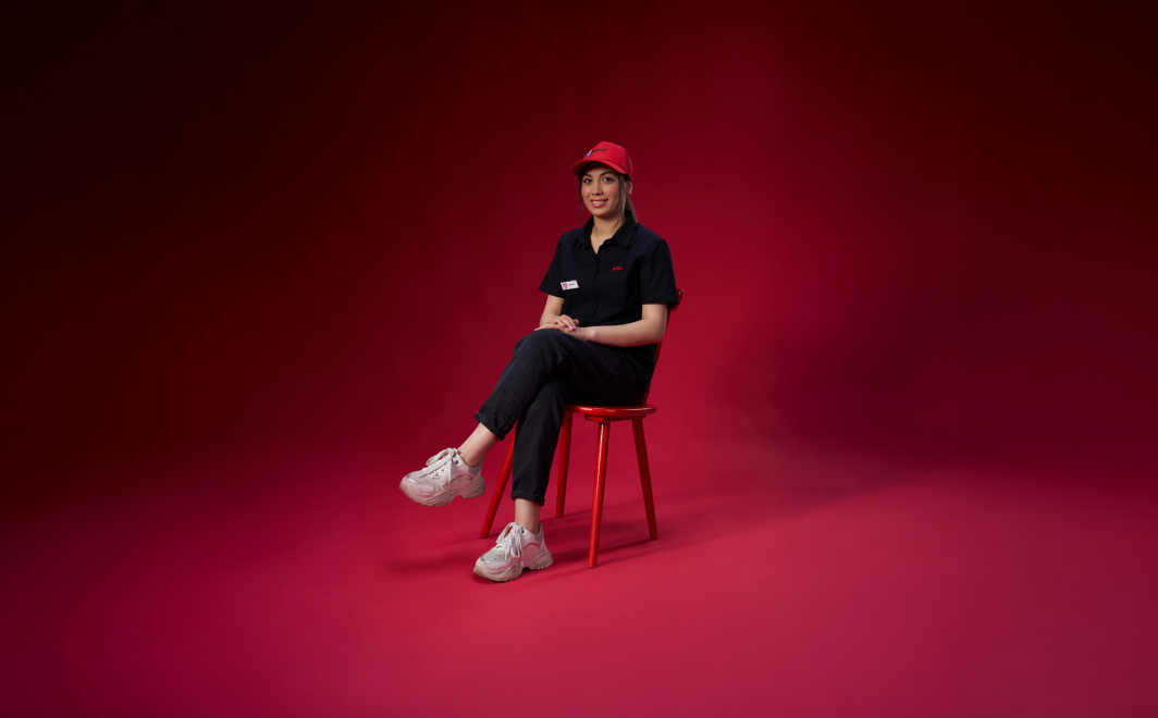 Shahed sitting on a chair